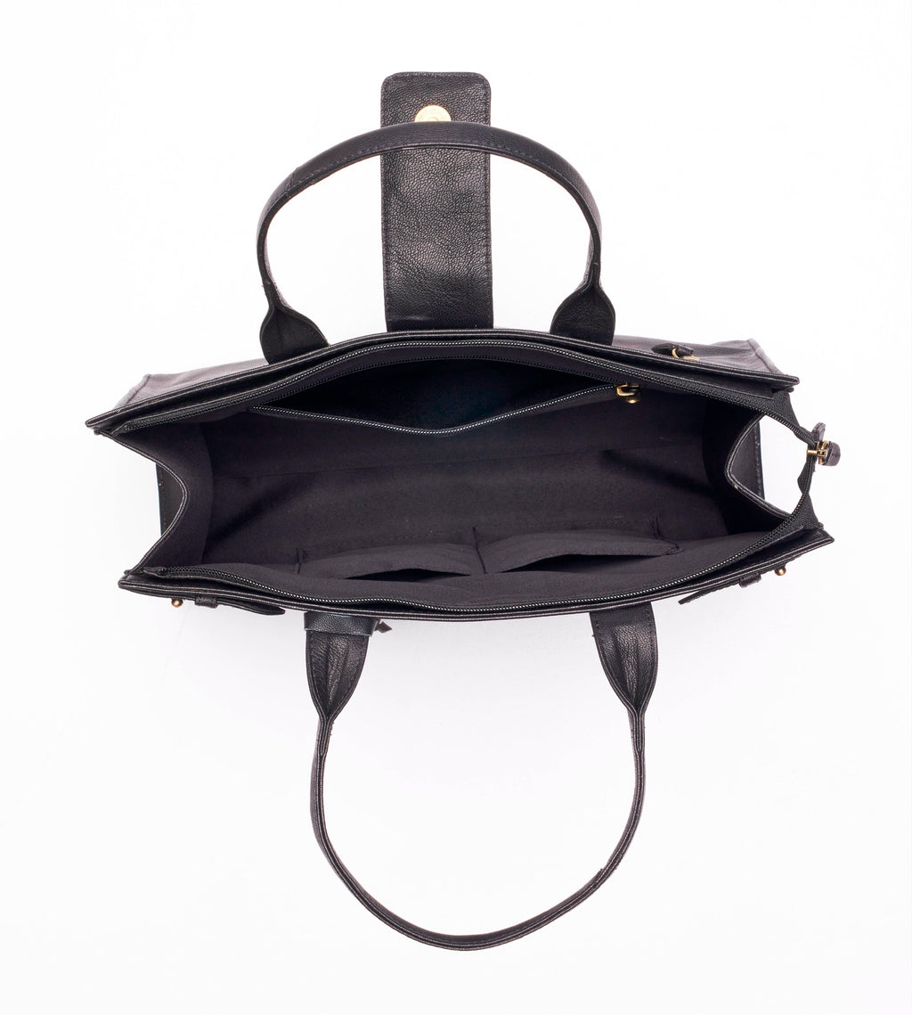 Structured leather tote bag open interior view showing multiple compartments