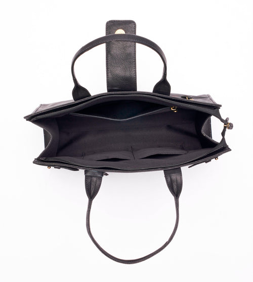 Structured leather tote bag open interior view showing multiple compartments